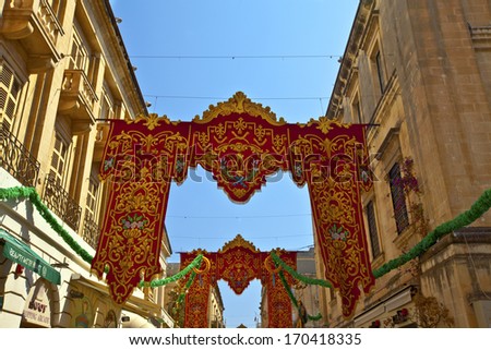 VALLETTA, MALTA - JULY 17 - Christian religious festival street decoration banners in Valletta, Island of Malta, July 17, 2013.