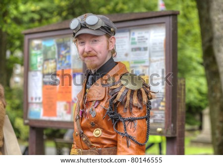 SADDLEWORTH, ENGLAND - JUNE 17: Young man in a  Steam Punk outfit at the Brass Band Contest on June 17th, 2011 in Saddleworth, England.