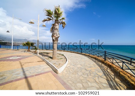 Promenade by the Mediterranean Sea in resort town of Nerja at Costa del Sol, southern Andalusia, Spain.