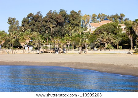 Marbella sandy beach by the sea summer holiday scenery in Spain, Andalusia region, Costa del Sol, Malaga province.