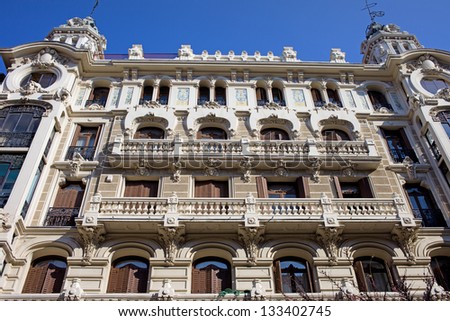 Ornate facade of an old apartment building in Madrid, Spain.