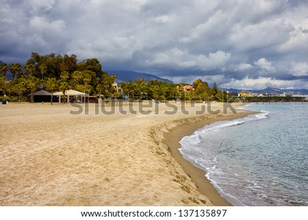 Beach in Marbella by the Mediterranean Sea in Spain, Malaga province, Andalusia region.