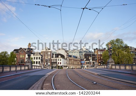 Transport infrastructure in the city of Amsterdam in Netherlands, street and tramway on the Hogesluis bridge (Hoge Sluis Brug).