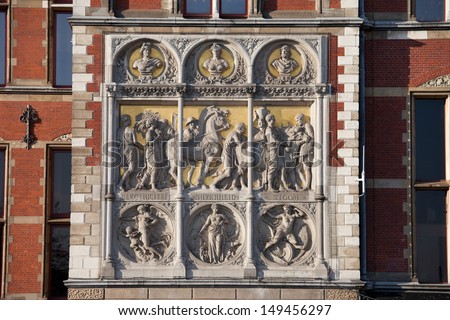 Reliefs on Amsterdam Central Train Station 19th century historical facade, Holland, Netherlands.