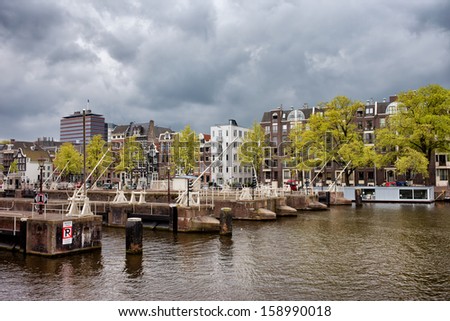 Amsterdam skyline, view from the Amstel river in North Holland, Netherlands.