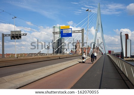 Street, sidewalk and bicycle path on Erasmus Bridge in the city of Rotterdam downtown, Netherlands.