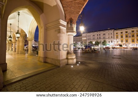 City of Krakow in Poland by night. Arcade of the Cloth Hall on the Main Square in the Old Town.