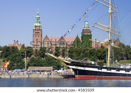 Admiring crowd watching at tall ship in Szczecin port, Poland.