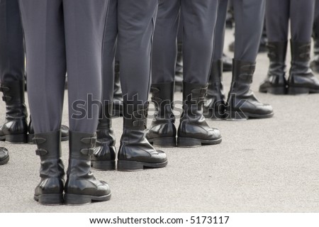 Soldiers standing at attention on parade ground.