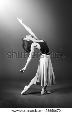 Ballet dancer performing on stage.