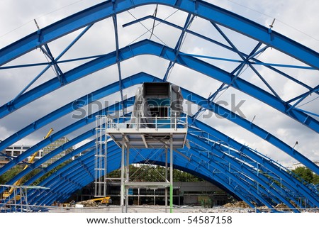 Metal frame structure on construction site of the shopping mall building