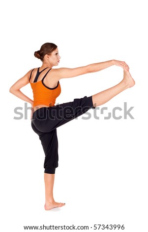 Woman doing first stage of yoga exercise called: Revolved Hand to Big Toe Pose, sanskrit name: Hasta Padangusthasana, isolated on white background