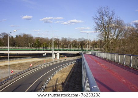 Urban scenery of a motorway and pedestrian foot bridge