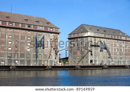 Old industrial buildings used as a granaries in the past at the Motlawa river waterfront in Gdansk, Poland
