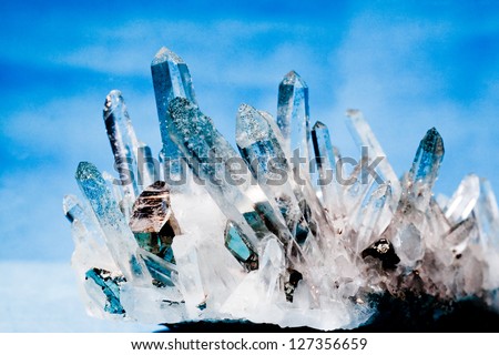 Big quartz crystals (rock crystal) with iron pyrite (fool\'s gold) crystals grown on.