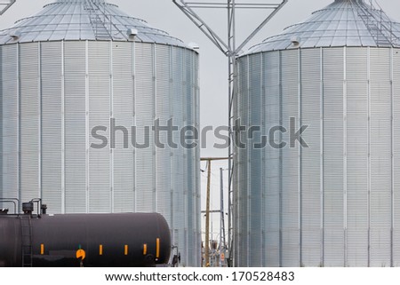 Railway tank wagon and agricultural silos of grain elevator storage and loading facility building exterior