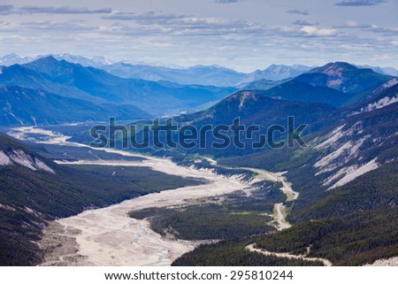 Aerial view of MacDonald Creek valley and Alaska Highway in Stone Mountain Provincial Park, British Columbia, Canada