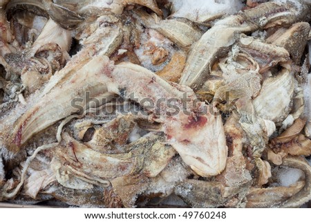 Frozen fish waste: heads, bones, guts, fins, and blood.