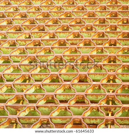 Steel grid floor of old steel bridge background pattern texture