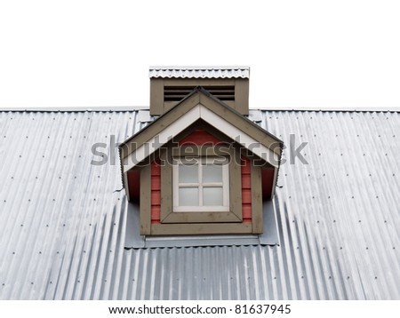 Architectural detail of small dormer window in metal sheet roof of residential house.