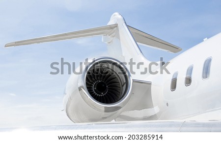 Jet Engine with a tail and part of a wing on a luxury private Jet Plane