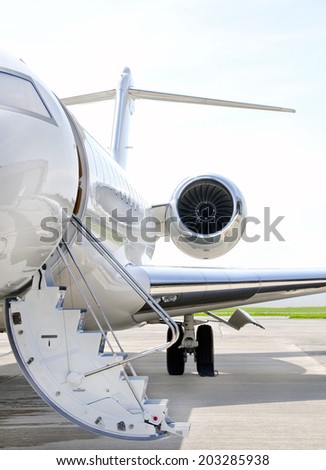 Stairs with Jet Engine on a modern private jet airplane