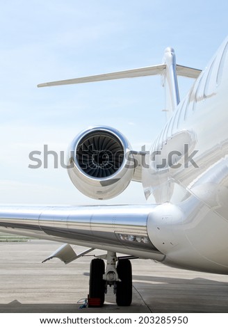 Flying luxury private aircraft. Jet Engine with a part of a wing