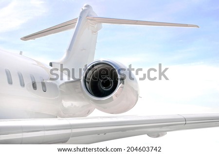 Running Jet Engine on a modern private jet airplane with a tail wing