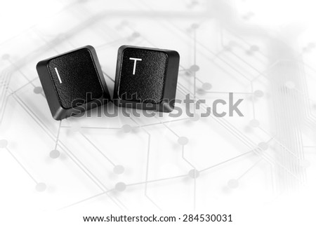 IT Helpdesk - Two Black Keyboard keys with letters I and T on White Circuit Board Background