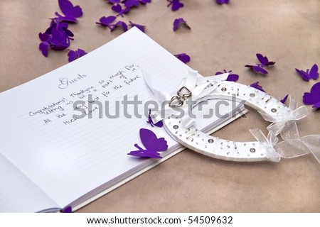 stock photo Opened Wedding Guest Book with a Good Luck Horseshoe and 