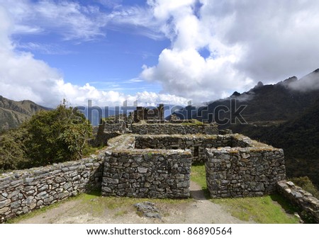 View of Runkuracay Ruins with Andes Moutain Range on the Inca Trail hike to Machu Picchu