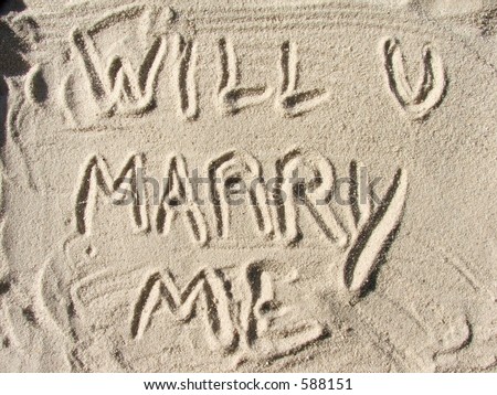 stock photo Will you marry me written in sand