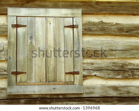 window shutter on a log cabin