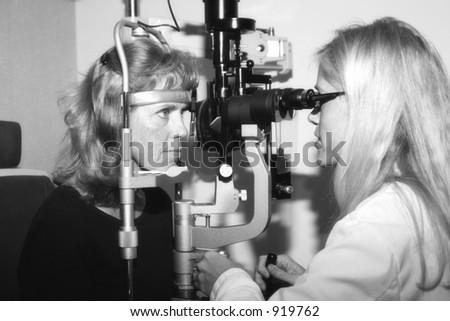 Eye doctor performing a routine exam