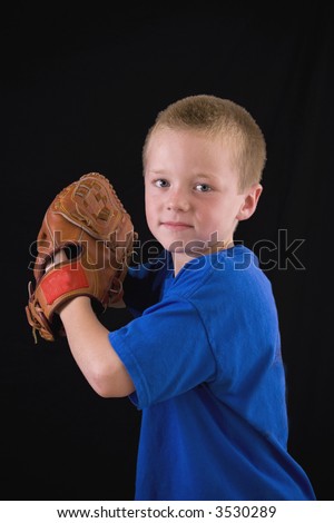 Cute little boy all ready for baseball practice.