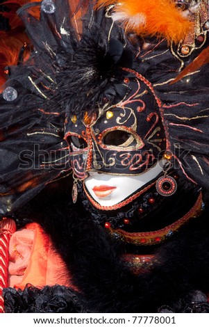 VENICE, ITALY - MARCH: Participant with a mask on in St. Mark\'s Square, Carnival of Venice on March, 2011 in Venice, Italy. The carnival was held from February 26 to March 8, 2011.
