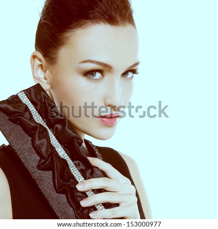 Beauty fashion woman with red nails holding purse-blue background