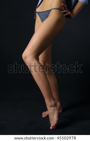 Beautiful legs isolated on a black