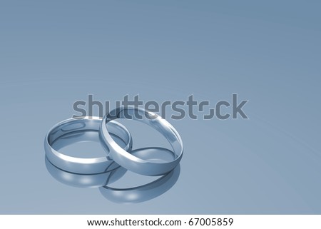 stock photo Silver wedding bands on a grey background