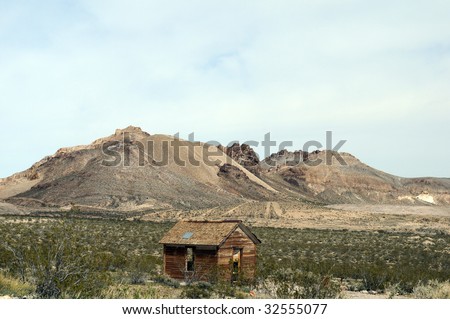derelict cabin left standing in old desert mining town
