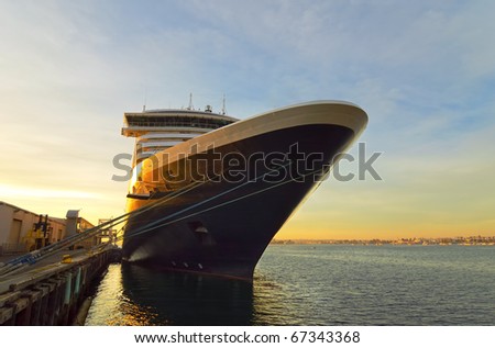 Gorgeous cruise ship at a dock during the sunset