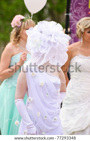 DONETSK, UKRAINE - MAY 15: Annual wedding parade. Bride parade participants in wedding gowns poses during the \