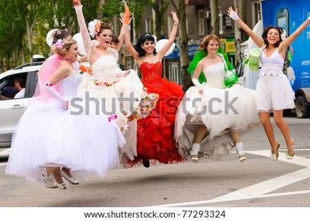 DONETSK, UKRAINE - MAY 15: Annual wedding parade. Bride parade participants in wedding gowns poses during the 