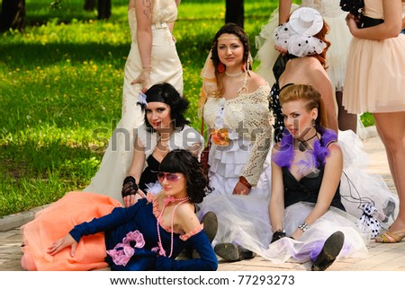 DONETSK, UKRAINE - MAY 15: Annual wedding parade. Bride parade participants in wedding gowns poses during the \