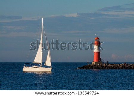Sailing boat on the Mole in Warnemuende (Germany).