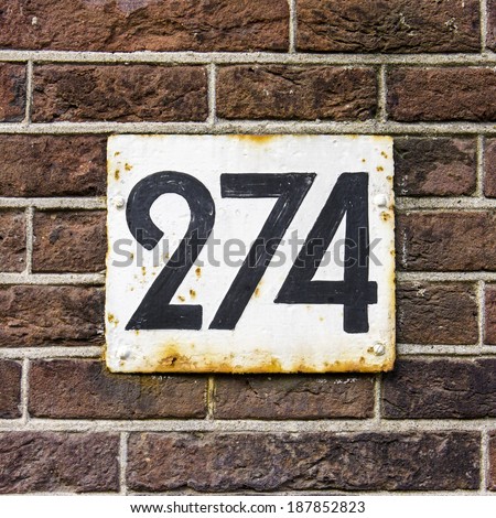 House number two hundred and seventy four.black lettering on a white background.