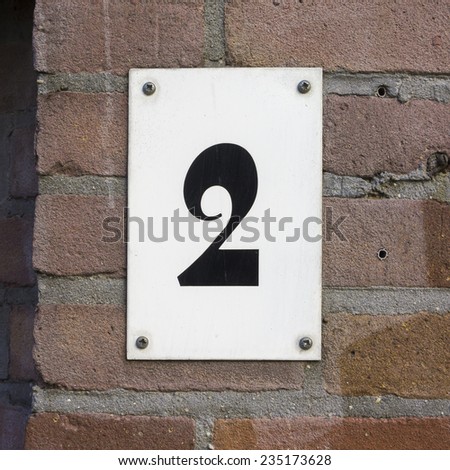 house number two. Black numeral on a white background