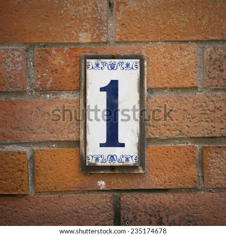 House number one on a ceramic tile