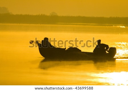 Traditional boat silhouette in the danube delta romania