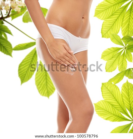 Woman legs with moisturizer horse chestnut body cream